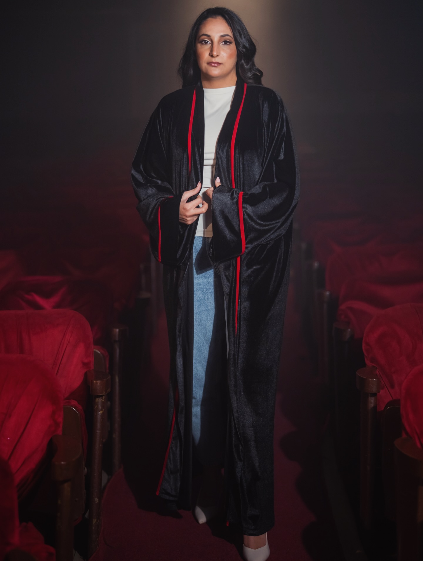 Black velvet abaya in theatre setting