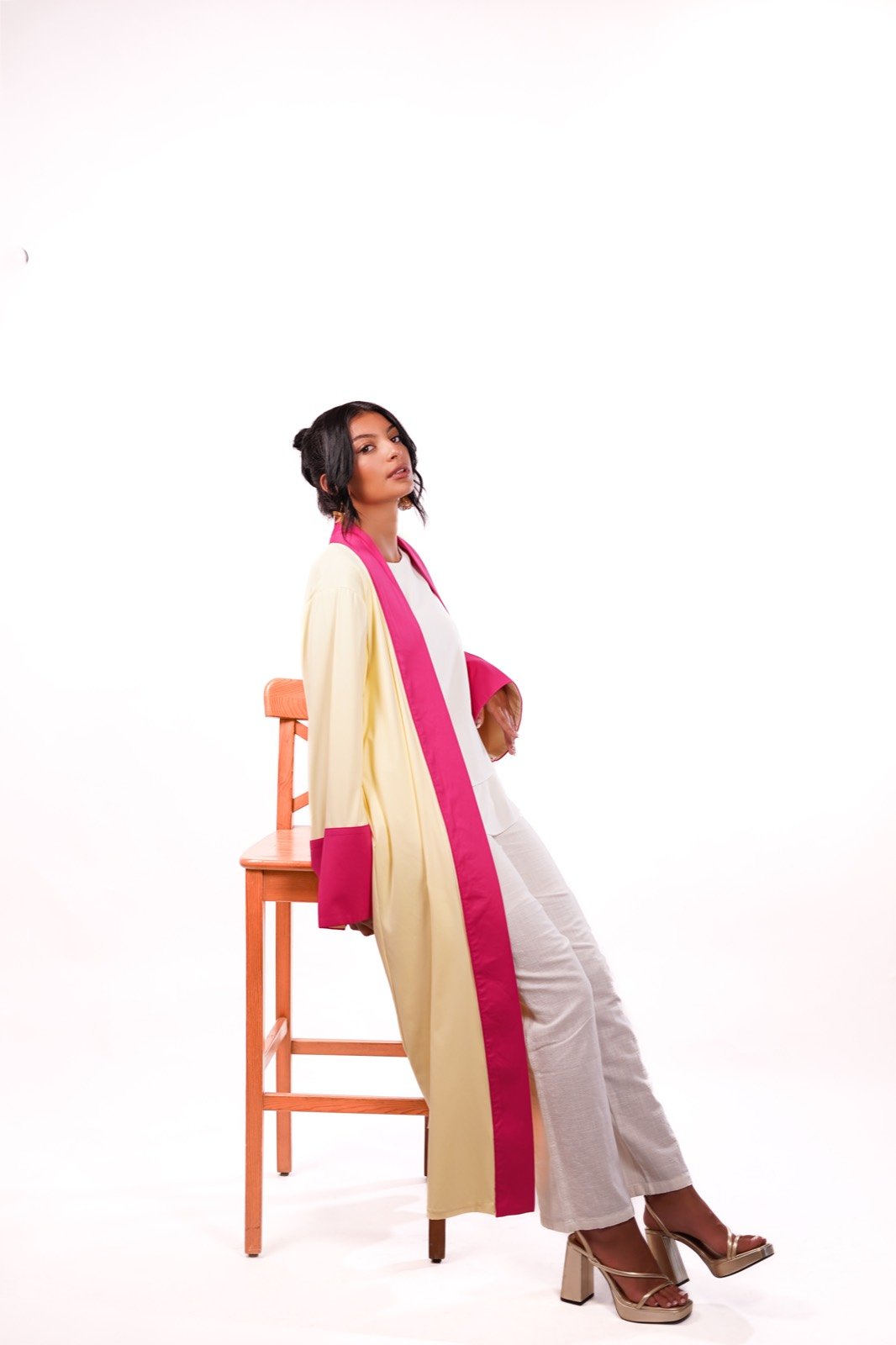 Rose Soleil open-front robe in cream with fuchsia trim, standing on a stool, full length, from the Le Kanz summer collection