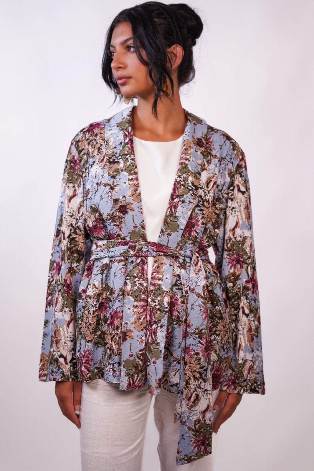Bluebell blazer in a muted floral print, front view, worn open, from the Le Kanz summer collection