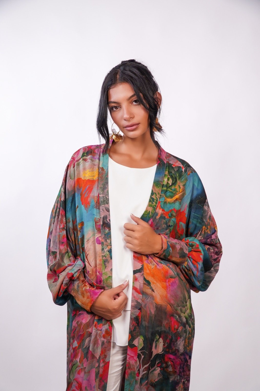 Tropical Muse open-front robe in a multicoloured painterly print, waist-up, robe held open, from the Le Kanz summer collection